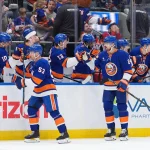 Apr 12, 2026; Elmont, New York, USA; New York Islanders center Casey Cizikas (53) and defenseman Scott Mayfield (24) celebrate a goal against the Montreal Canadiens in the third period at UBS Arena.