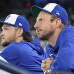 Mar 29, 2026; Toronto, Ontario, CAN; Toronto Blue Jays pitcher Trey Yesavage (39) and pitcher Max Scherzer (31) in the dugout before the start of the game against the Athletics at Rogers Centre.