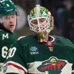 Apr 14, 2026; Saint Paul, Minnesota, USA; Minnesota Wild goaltender Jesper Wallstedt (30) reacts to teammates congratulating him after saving a Anaheim Ducks shot in the third period at Grand Casino Arena
