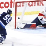 Nov 19, 2024; Winnipeg, Manitoba, CAN; Winnipeg Jets center Mark Scheifele (55) scores on Florida Panthers goaltender Sergei Bobrovsky (72) in the third period at Canada Life Centre.