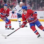 9 avril 2026; Montréal, Québec, Canada; L\'attaquant des Canadiens de Montréal, Cole Caufield (13), contrôle la rondelle durant la première période contre le Lightning de Tampa Bay au Centre Bell.