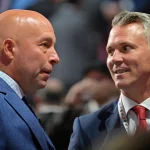 Jul 7, 2022; Montreal, Quebec, CANADA; Montreal Canadiens general manager Kent Hughes (left) talks with head coach Martin St. Louis before the first round of the 2022 NHL Draft at Bell Centre. Mandatory Credit: Eric Bolte-Imagn Images