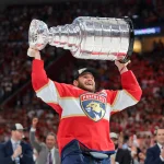 Jun 17, 2025; Sunrise, Florida, USA; Florida Panthers center Aleksander Barkov (16) hoists the Stanley Cup after winning game six of the 2025 Stanley Cup Final against the Edmonton Oilers at Amerant Bank Arena.