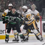 Dec 7, 2025; Dallas, Texas, USA; Dallas Stars left wing Jason Robertson (21) calls for the puck in front of Pittsburgh Penguins defenseman Ryan Graves (27) and defenseman Matt Dumba (24) and goaltender Tristan Jarry (35) during the first period at American Airlines Center. Mandatory Credit: Jerome Miron-Imagn Images