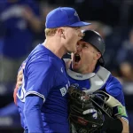 Sep 15, 2025; Tampa, Florida, USA; Toronto Blue Jays catcher Tyler Heineman (55) and pitcher Braydon Fisher (63) celebrate after beating the Tampa Bay Rays in extra inning at George M. Steinbrenner Field. Mandatory Credit: Nathan Ray Seebeck-Imagn Images