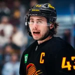 Dec 11, 2025; Vancouver, British Columbia, CAN; Vancouver Canucks defenseman Quinn Hughes (43) during a stop in play against the Buffalo Sabres in the first period at Rogers Arena. Mandatory Credit: Bob Frid-Imagn Images