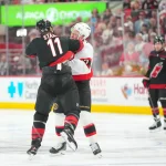 Apr 18, 2026; Raleigh, North Carolina, USA; Ottawa Senators left wing Brady Tkachuk (7) and Carolina Hurricanes center Jordan Staal (11) fight during the first period in game one of the first round of the 2026 Stanley Cup Playoffs at Lenovo Center. Mandatory Credit: James Guillory-Imagn Images