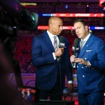 Jun 14, 2025; Edmonton, Alberta, CAN; Sportsnet host David Amber (left) and NHL Insider Elliotte Friedman (right) prior to the game between the Edmonton Oilers and the Florida Panthers in game five of the 2025 Stanley Cup Final at Rogers Place. Mandatory Credit: Sergei Belski-Imagn Images