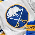 Nov 22, 2022; Montreal, Quebec, CAN; View of a Buffalo Sabres logo on a jersey worn by a member of the team during warm-up before the game against the Montreal Canadiens at Bell Centre. Mandatory Credit: David Kirouac-Imagn Images