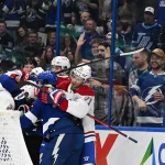 Mar 31, 2026; Tampa, Florida, USA; Members of the Montreal Canadian and Tampa Bay Lightning fight in the third period at Benchmark International Arena.