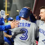 Apr 17, 2026; Phoenix, Arizona, USA; Toronto Blue Jays center fielder Myles Straw (3) is greeted by teammates after scoring a run against the Arizona Diamondbacks during the fourth inning at Chase Field. Mandatory Credit: Joe Camporeale-Imagn Images