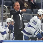 Dec 2, 2025; Elmont, New York, USA; Tampa Bay Lightning head coach Jon Cooper coaches against the New York Islanders during the first period at UBS Arena. Mandatory Credit: Brad Penner-Imagn Images