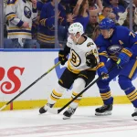 Apr 19, 2026; Buffalo, New York, USA; Boston Bruins center James Hagens (44) tries to control the puck as Buffalo Sabres center Tage Thompson (72) defends during the third period in game one of the first round of the 2026 Stanley Cup Playoffs at KeyBank Center. Mandatory Credit: Timothy T. Ludwig-Imagn Images