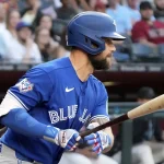 Apr 18, 2026; Phoenix, Arizona, USA; Toronto Blue Jays right fielder Nathan Lukes (38) hits a single against the Arizona Diamondbacks in the first inning at Chase Field. Mandatory Credit: Rick Scuteri-Imagn Images
