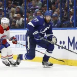 Jun 30, 2021; Tampa, Florida, USA; Tampa Bay Lightning defenseman Victor Hedman (77) chases the puck against Montreal Canadiens center Nick Suzuki (14) during the third period in game two of the 2021 Stanley Cup Final at Amalie Arena. Mandatory Credit: Kim Klement-Imagn Images