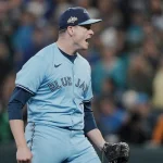 Oct 17, 2025; Seattle, Washington, USA; Toronto Blue Jays pitcher Louis Varland (77) reacts after throwing against the Seattle Mariners in the seventh inning during game five of the ALCS round for the 2025 MLB playoffs at T-Mobile Park. Mandatory Credit: Stephen Brashear-Imagn Images