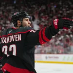 Apr 20, 2026; Raleigh, North Carolina, USA; Carolina Hurricanes center Logan Stankoven (22) celebrates his goal against the Ottawa Senators during the first period in game two of the first round of the 2026 Stanley Cup Playoffs at Lenovo Center.