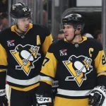 Mar 31, 2026; Pittsburgh, Pennsylvania, USA; Pittsburgh Penguins center Evgeni Malkin (71) and center Sidney Crosby (87) talk on the ice against the Detroit Red Wings during the first period at PPG Paints Arena. Mandatory Credit: Charles LeClaire-Imagn Images
