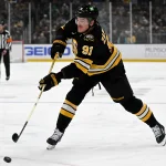 Mar 31, 2026; Boston, Massachusetts, USA; Boston Bruins defenseman Nikita Zadorov (91) attempts a shot against the Dallas Stars during the first period at the TD Garden