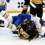 Apr 23, 2026; Boston, Massachusetts, USA; Buffalo Sabres center Peyton Krebs (19) collides with Boston Bruins defenseman Charlie McAvoy (73) during the second period of game three of the first round of the 2026 Stanley Cup Playoffs at the TD Garden. :