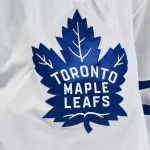 Jan 18, 2025; Montreal, Quebec, CAN; View of a Toronto Maple Leafs logo on a jersey worn by a member of the team during the second period at Bell Centre.