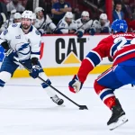 Apr 26, 2026; Montreal, Quebec, CAN; Tampa Bay Lightning right wing Nikita Kucherov (86) plays the puck agianst Montreal Canadiens center Phillip Danault (24) during the second period in game four of the first round of the 2026 Stanley Cup Playoffs at Bell Centre.