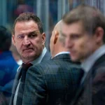 Jan 18, 2025; Vancouver, British Columbia, CAN; Vancouver Canucks assistant coach Adam Foote on the bench against the Edmonton Oilers in the second period at Rogers Arena.