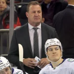 Dec 16, 2025; New York, New York, USA; Vancouver Canucks head coach Adam Foote coaches against the New York Rangers during the first period at Madison Square Garden.