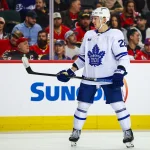 Feb 2, 2026; Calgary, Alberta, CAN; Toronto Maple Leafs defenseman Troy Stecher (28) against the Calgary Flames during the third period at Scotiabank Saddledome. Mandatory Credit: Sergei Belski-Imagn Images