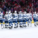 Apr 26, 2026; Montreal, Quebec, CAN; Tampa Bay Lightning players gather together to celebrate their win against the Montreal Canadiens after the end of game four of the first round of the 2026 Stanley Cup Playoffs at Bell Centre.