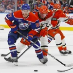 Apr 22, 2026; Edmonton, Alberta, CAN;Anaheim Ducks defensemen Jacob Trouba (65) tries to tie up the stick of Edmonton Oilers forward Connor McDavid (97) during the third period in game two of the first round of the 2026 Stanley Cup Playoffs at Rogers Place.