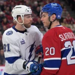 Apr 9, 2026; Montreal, Quebec, CAN; Tampa Bay Lightning defenseman Erik Cernak (81) vies for position with Montreal Canadiens forward Juraj Slafkovsky (20) during the second period at the Bell Centre.