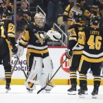 Mar 13, 2025; Pittsburgh, Pennsylvania, USA; Pittsburgh Penguins center Evgeni Malkin (71) and goaltender Tristan Jarry (35) and defenseman Erik Karlsson (65) and center Blake Lizotte (46) celebrate after defeating the St. Louis Blues at PPG Paints Arena.