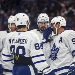 Feb 25, 2026; Tampa, Florida, USA; Toronto Maple Leafs forward Auston Matthews (34), defenseman Morgan Rielly (44), forward William Nylander (88), and forward John Tavares (91) huddle before a face-off against the Tampa Bay Lightning during the second period at Benchmark International Arena.