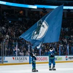 Apr 14, 2026; Vancouver, British Columbia, CAN; Fin the mascot and the Vancouver Canucks celebrate their victory against the Los Angeles Kings at Rogers Arena.