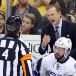May 22, 2016; Pittsburgh, PA, USA; Tampa Bay Lightning head coach Jon Cooper (right) yells to referee Wes McCauley (4) during the third period against the Pittsburgh Penguins in game five of the Eastern Conference Final of the 2016 Stanley Cup Playoffs at the CONSOL Energy Center. Tampa Bay won 4-3 in overtime to take a three games to two lead in the series. Mandatory Credit: Charles LeClaire-Imagn Images
