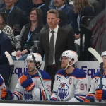 Apr 7, 2026; Salt Lake City, Utah, USA; Edmonton Oilers head coach Kris knoblauch watches play against the Utah Mammoth during the first period at Delta Center.