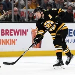 Apr 11, 2026; Boston, Massachusetts, USA; Boston Bruins defenseman Charlie McAvoy (73) attempts a shot against the Tampa Bay Lightning during the first period at the TD Garden.