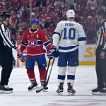 May 1, 2026; Montreal, Quebec, CAN; Montreal Canadiens forward Brendan Gallagher (11) and Tampa Bay Lightning forward Corey Perry (10) exchange words during the third period in game six of the first round of the 2026 Stanley Cup Playoffs at the Bell Centre.