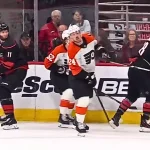 Nick Seeler pulls Martinooks stick into his face for a call