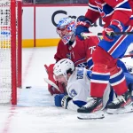 May 1, 2026; Montreal, Quebec, CAN; Tampa Bay Lightning forward Gage Goncalves (93) scores the winning goal against Montreal Canadiens goalie Jakub Dobes (75) during the overtime period in game six of the first round of the 2026 Stanley Cup Playoffs at the Bell Centre.