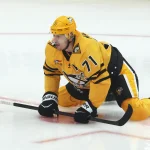 Apr 27, 2026; Pittsburgh, Pennsylvania, USA; Pittsburgh Penguins center Evgeni Malkin (71) stretches on the ice to warm up against the Philadelphia Flyers in game five of the first round of the 2026 Stanley Cup Playoffs at PPG Paints Arena.