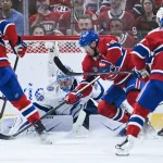 26 avril 2026 ; Montréal, Québec, Canada ; Le gardien du Lightning de Tampa Bay, Andrei Vasilevskiy (88), effectue un arrêt face au centre des Canadiens de Montréal, Nick Suzuki (14), au cours de la deuxième période du quatrième match du premier tour des séries éliminatoires de la Coupe Stanley 2026, au Centre Bell.