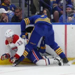May 6, 2026; Buffalo, New York, USA; Buffalo Sabres center Tage Thompson (72) checks Montréal Canadiens right wing Cole Caufield (13) as he goes after a loose puck during the third period in game one of the second round of the 2026 Stanley Cup Playoffs at KeyBank Center. Mandatory Credit: Timothy T. Ludwig-Imagn Images