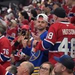 May 10, 2026; Montreal, Quebec, CAN; Buffalo Sabres fan and Montreal Canadiens fan during the second period in game three of the second round of the 2026 Stanley Cup Playoffs at the Bell Centre. Mandatory Credit: Eric Bolte-Imagn Images