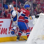 May 10, 2026; Montreal, Quebec, CAN; Montreal Canadiens defenseman Mike Matheson (8) checks Buffalo Sabres defenseman Rasmus Dahlin (26) into the boards during the first period in game three of the second round of the 2026 Stanley Cup Playoffs at the Bell Centre. Mandatory Credit: Eric Bolte-Imagn Images