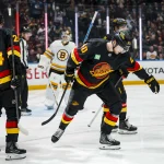 Jan 3, 2026; Vancouver, British Columbia, CAN; Vancouver Canucks forward Linus Karlsson (94) and defenseman Zeev Buium (24) and forward Jake DeBrusk (74) celebrate a goal scored by forward Elias Pettersson (40) against the Boston Bruins in the second period at Rogers Arena. Mandatory Credit: Bob Frid-Imagn Images