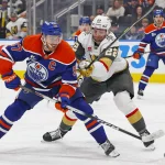 Edmonton Oilers blocked by division rival in coaching search Apr 4, 2026; Edmonton, Alberta, CAN; Edmonton Oilers forward Connor McDavid (97) gets a shot away in front of Vegas Golden Knights forward Cole Schwindt (22) during the third period at Rogers Place. Mandatory Credit: Perry Nelson-Imagn Images