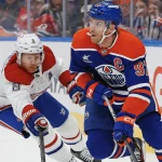 Transaction potentielle impliquant Connor McDavid et le Canadien: une information fait grandement réagir 6 mars 2025 ; Edmonton, Alberta, Canada ; L\'attaquant des Oilers d\'Edmonton, Connor McDavid (97), tente de faire une passe devant le défenseur des Canadiens de Montréal, Mike Matheson (8), au cours de la première période au Rogers Place.