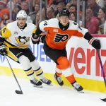 Apr 29, 2026; Philadelphia, Pennsylvania, USA; Philadelphia Flyers right wing Owen Tippett (74) skates against Pittsburgh Penguins defenseman Ryan Shea (5) in the third period in game six of the first round of the 2026 Stanley Cup Playoffs at Xfinity Mobile Arena. Mandatory Credit: Kyle Ross-Imagn Images